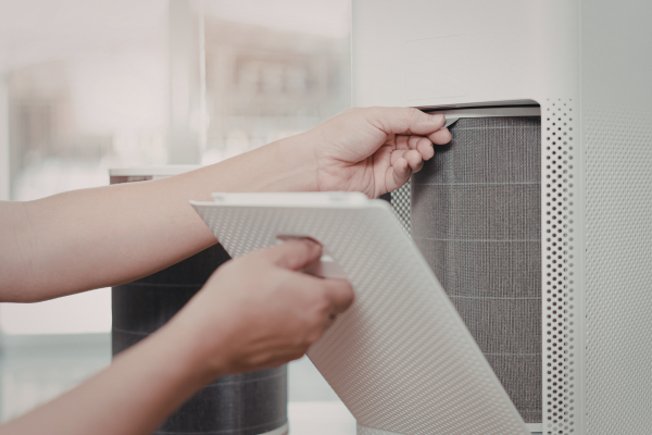 Technician Adjusting Internal Components of a Air Purifier