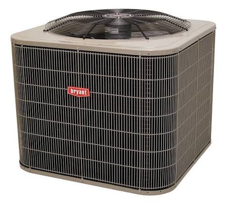 A beige Bryant 215S outdoor heat pump condenser unit with a top-mounted fan and wire grille, serviced by ATX Heating & Air Conditioning.